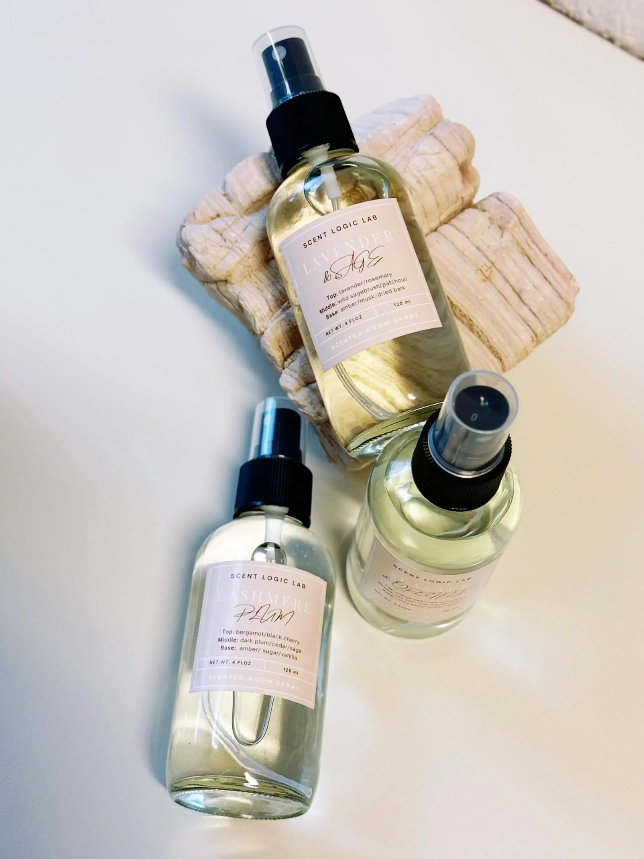 Three bottles of a product with labels on a light background